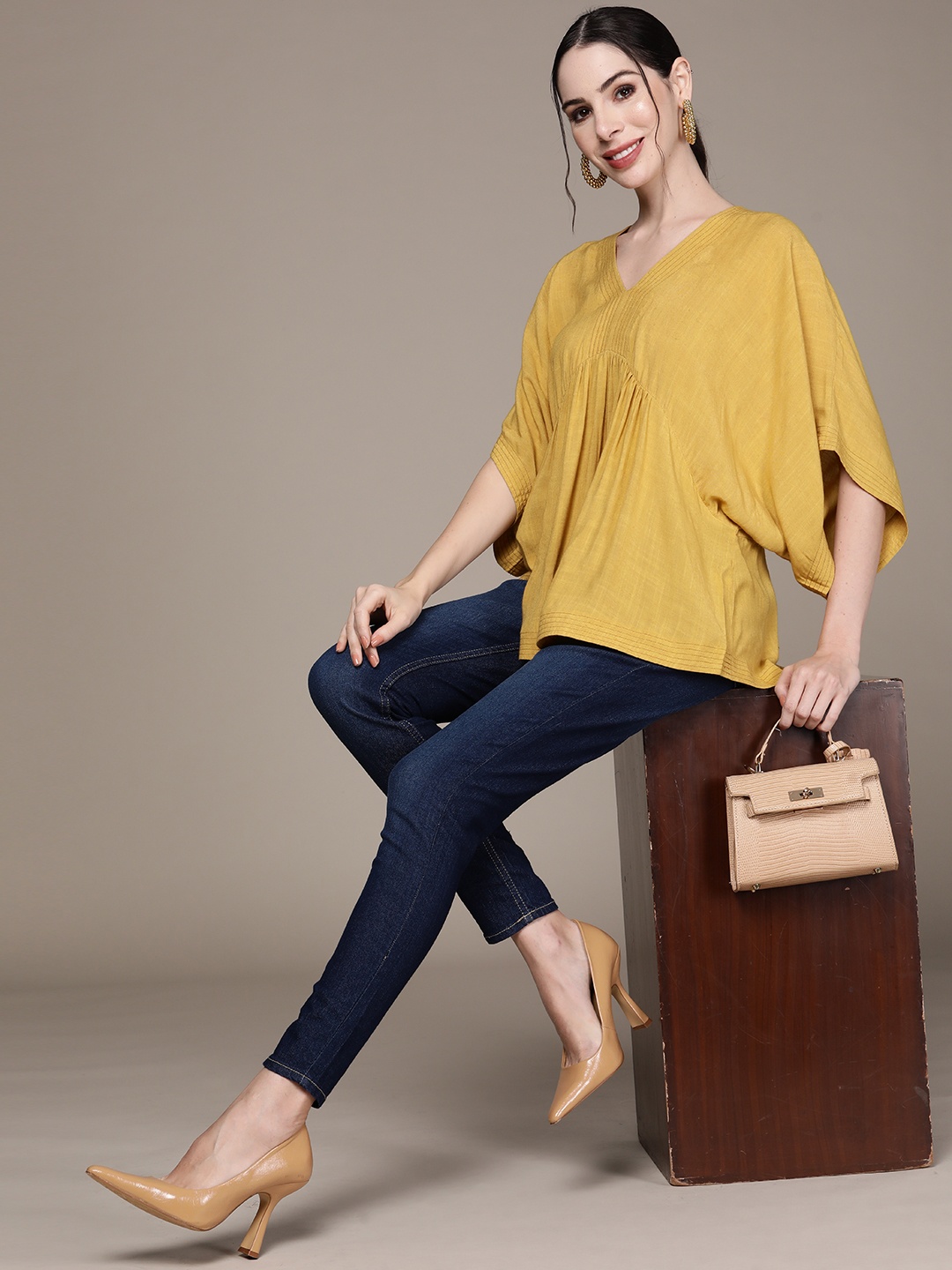 

aarke Ritu Kumar Mustard Yellow Extended Sleeves Top