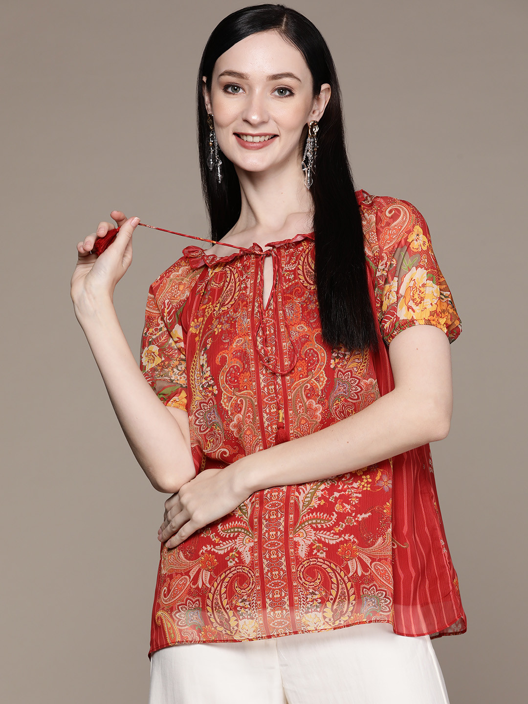 

aarke Ritu Kumar Orange & Yellow Print Tie-Up Neck Ruffles Chiffon Empire Top