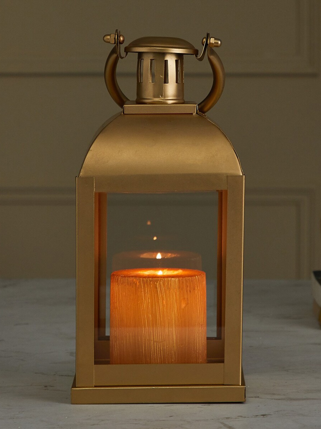 

Home Centre Gold-Toned Solid Metal Candle Holder