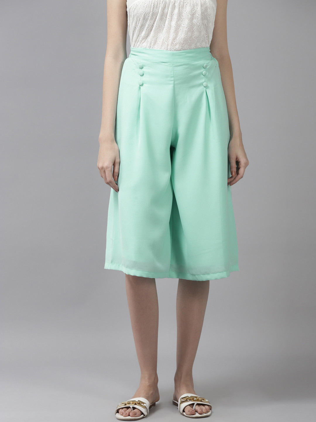 

Aarika Women Green Solid Loose Fit Capri