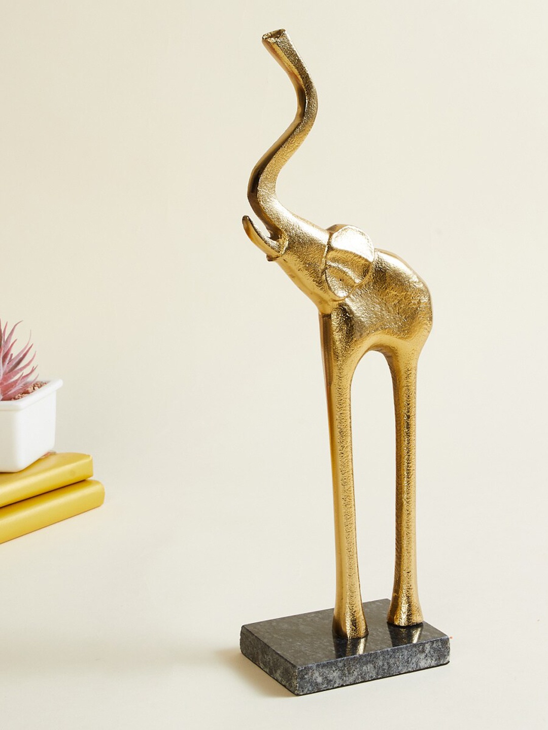 

Home Centre Gold-Toned Textured Aluminium Elephant Figurine With Base Showpieces