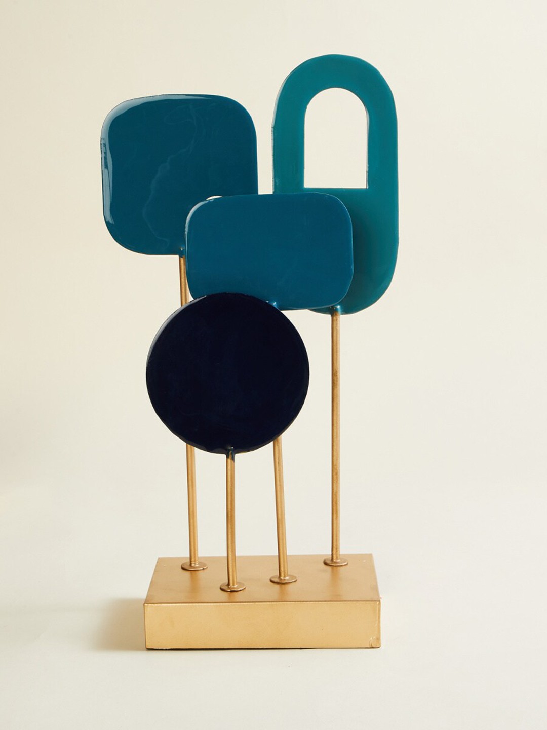 

Home Centre Blue & Gold Textured Metal Table Stand Showpiece