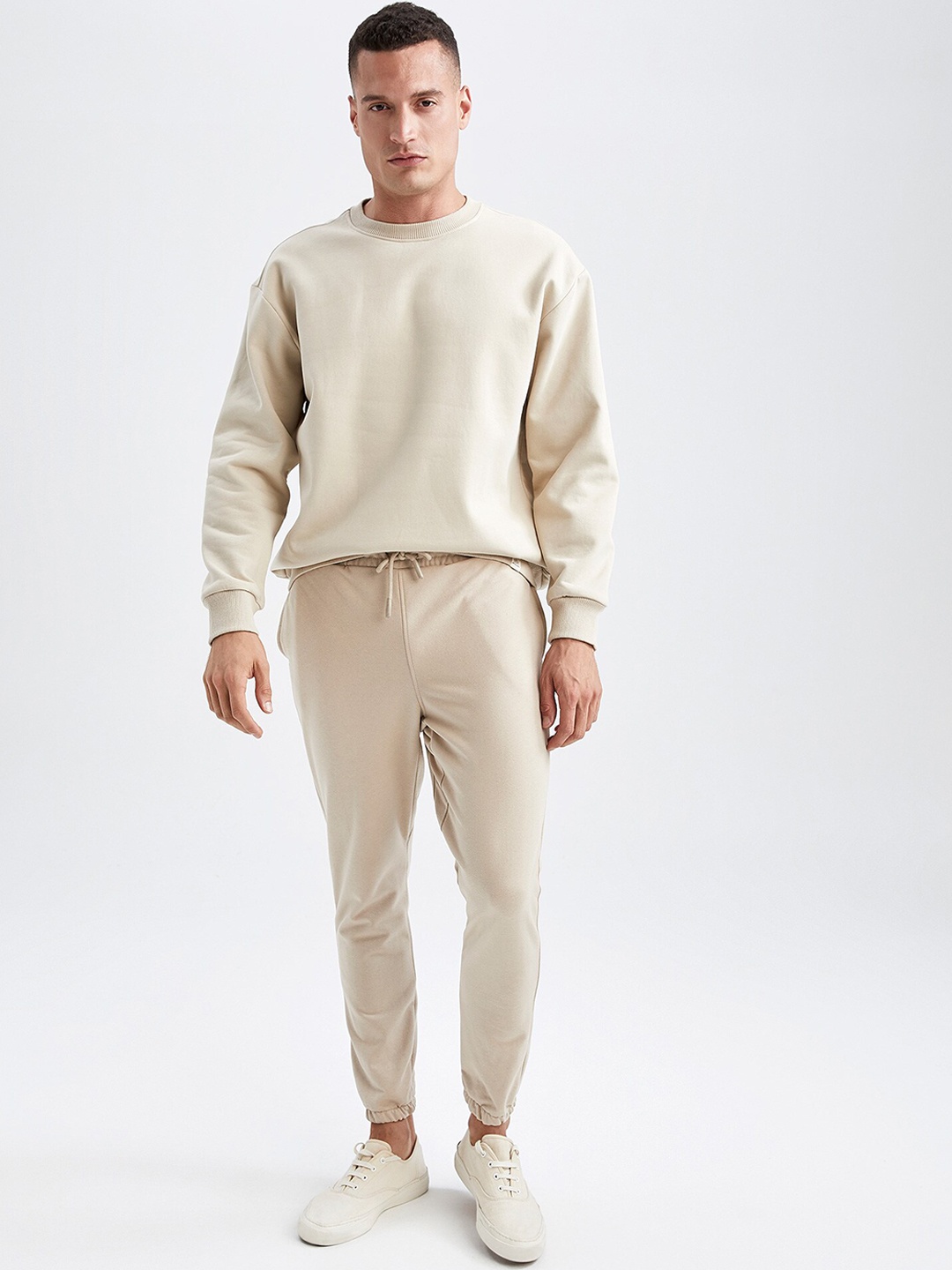 

DeFacto Men Beige Trousers