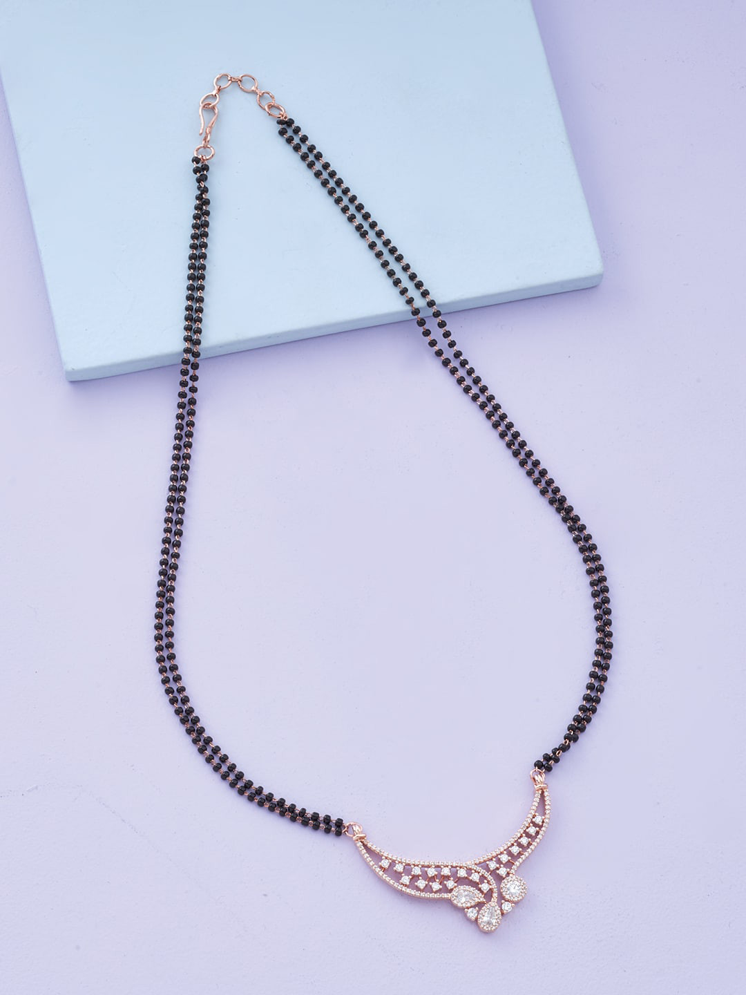 

Kushal's Fashion Jewellery White Cubic Zirconia Studded Rose Gold-Plated Mangalsutra