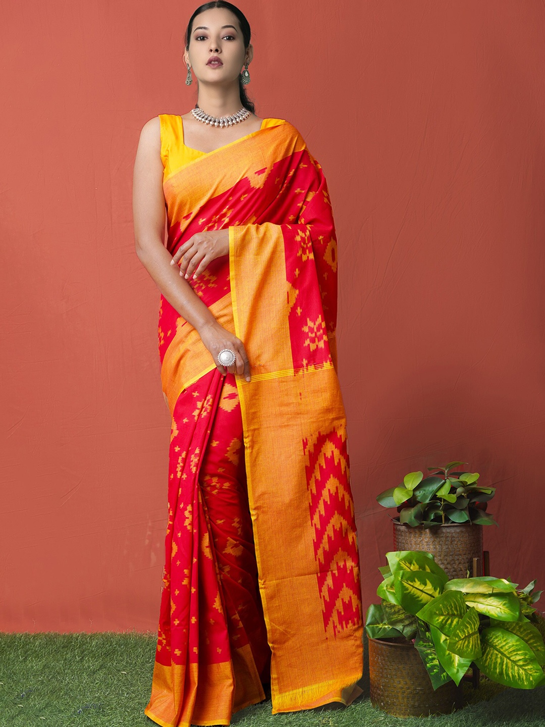

Unnati Silks Red & Yellow Ethnic Motifs Silk Cotton Pochampally Saree