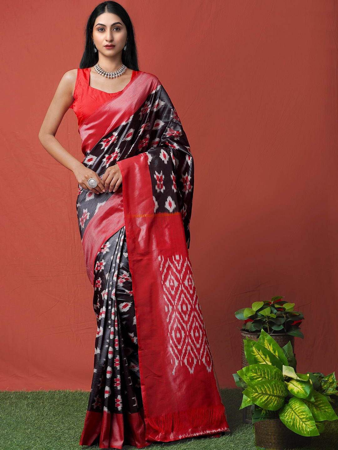 

Unnati Silks Black & Pink Zari Silk Cotton Pochampally Saree