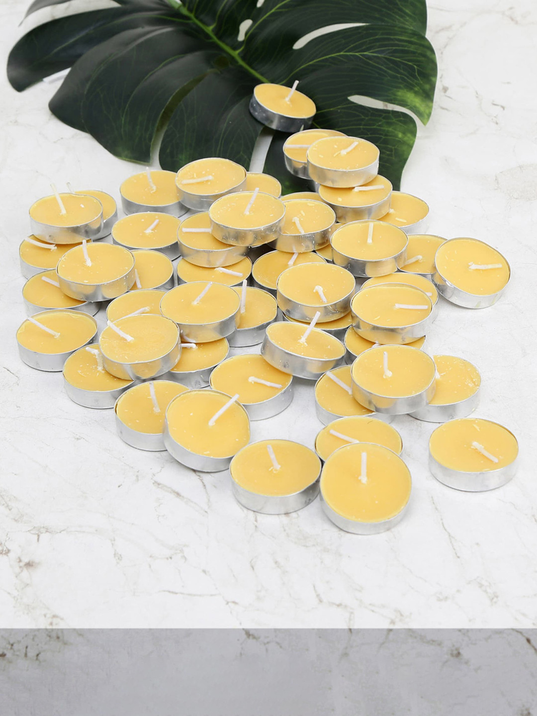 

Home Centre Set of 50 Yellow Solid T-Light Candles