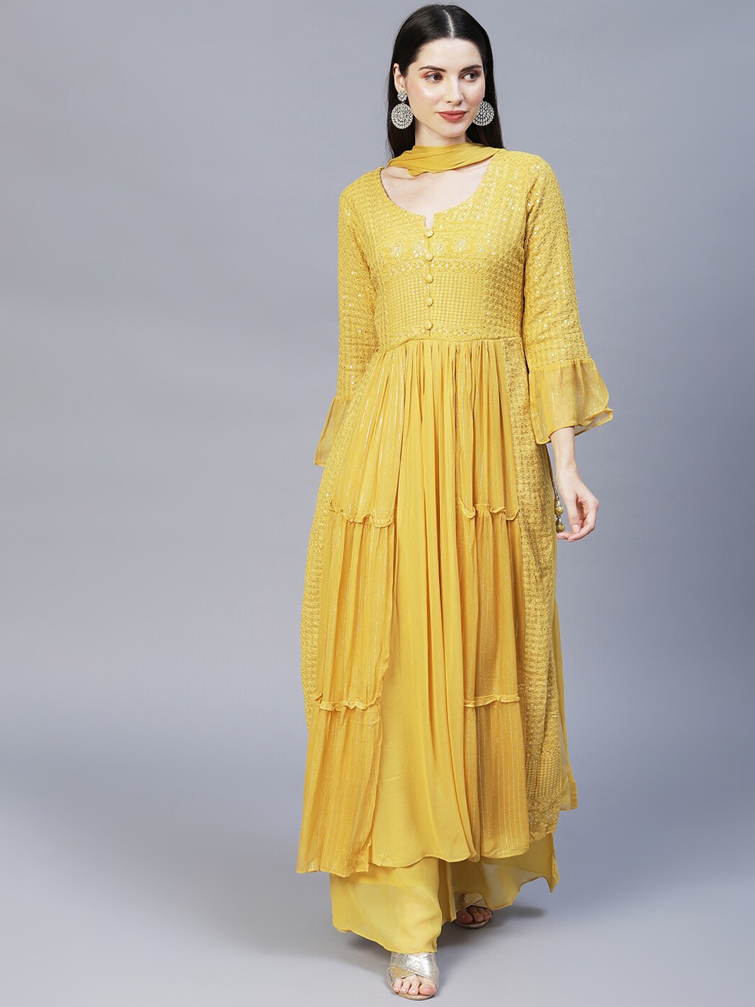 

FASHOR Women Yellow Ethnic Motifs Embroidered Tiered Sequinned Kurta with Palazzos & With Dupatta