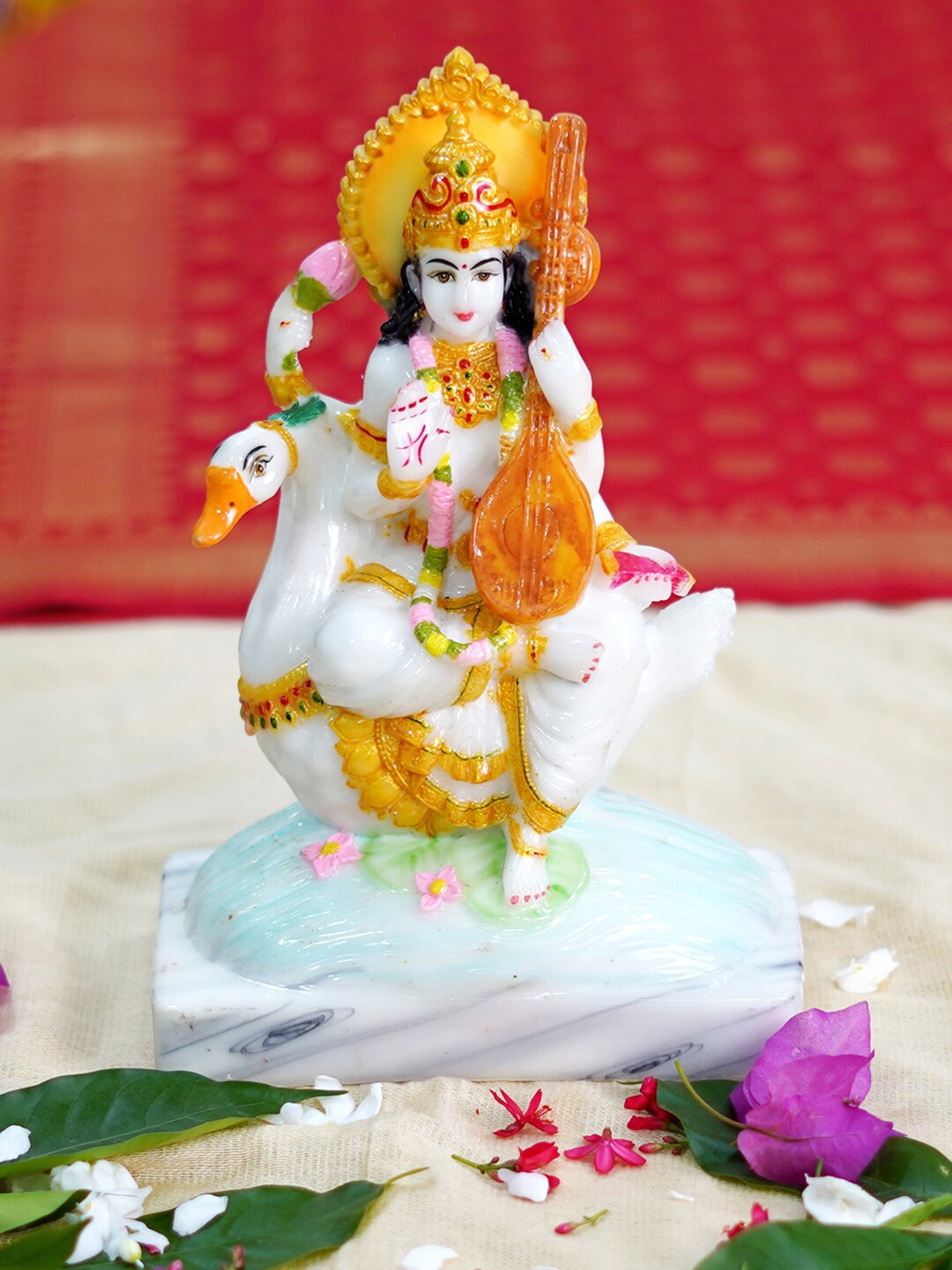 

Gallery99 White & Gold Toned Printed Saraswati Idol Marble Showpiece