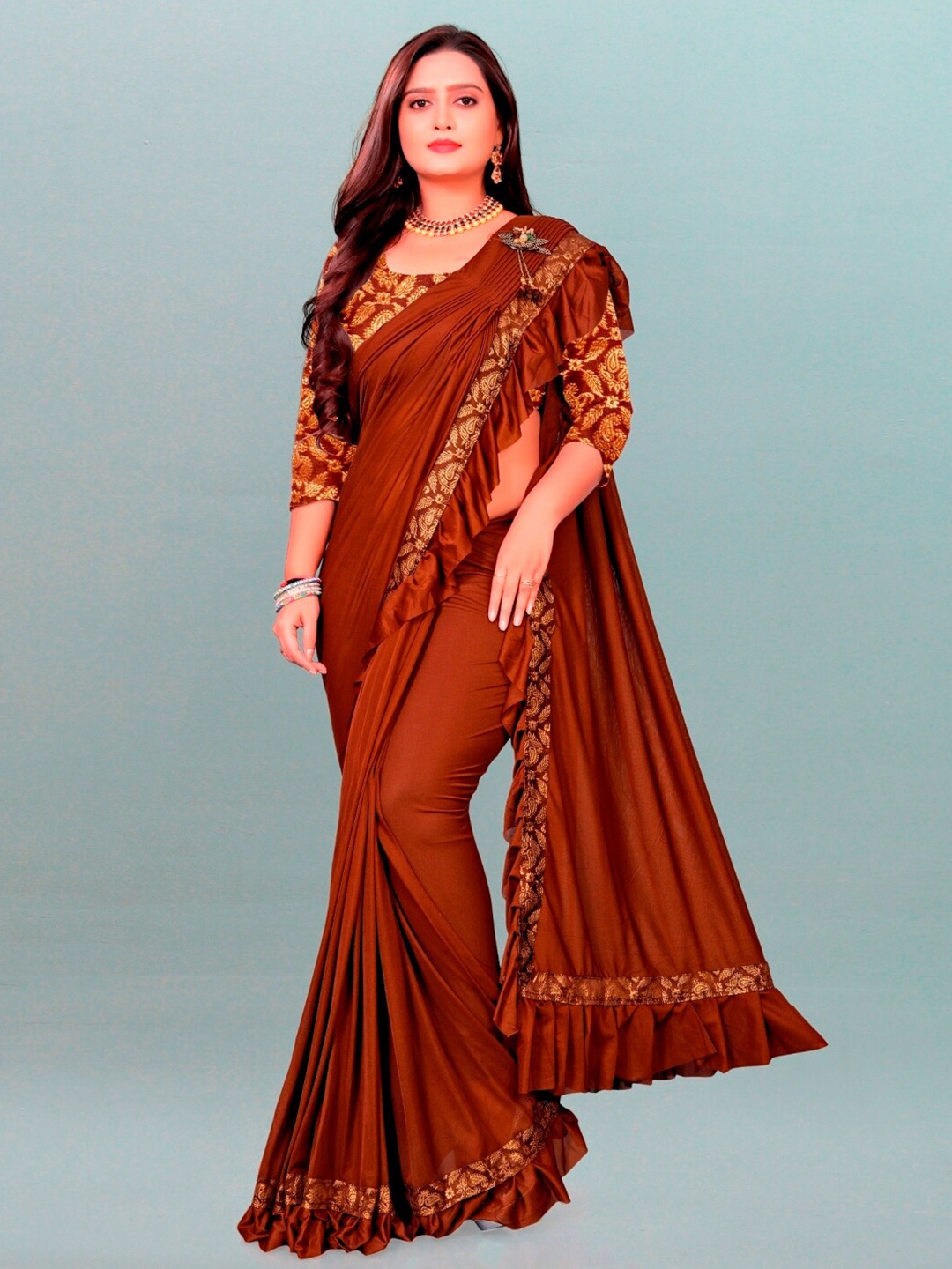 

APNISHA Brown & Gold-Toned Embroidered Ruffle Lycra Saree