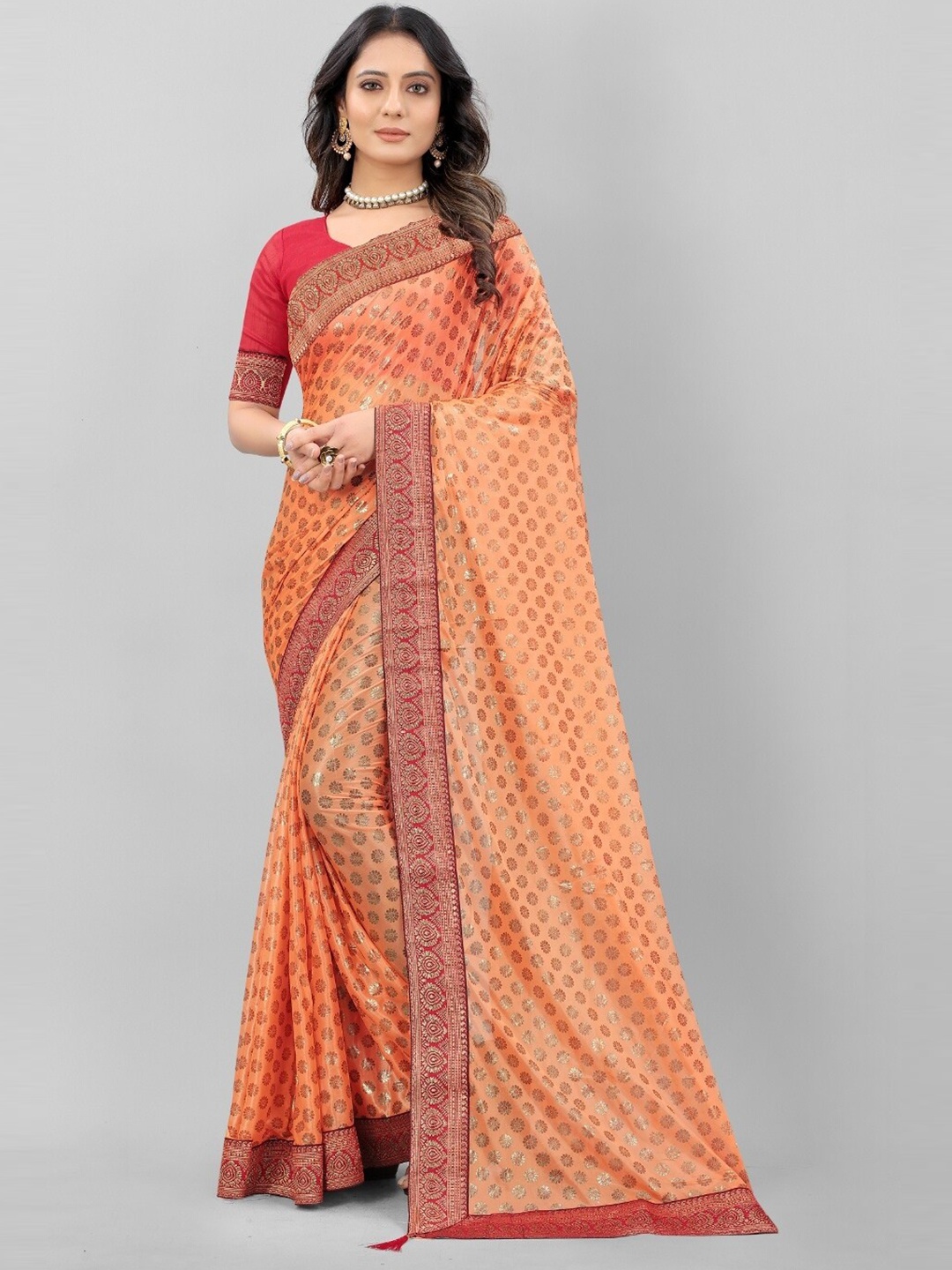 

APNISHA Orange & Gold-Toned Ethnic Motifs Printed Saree