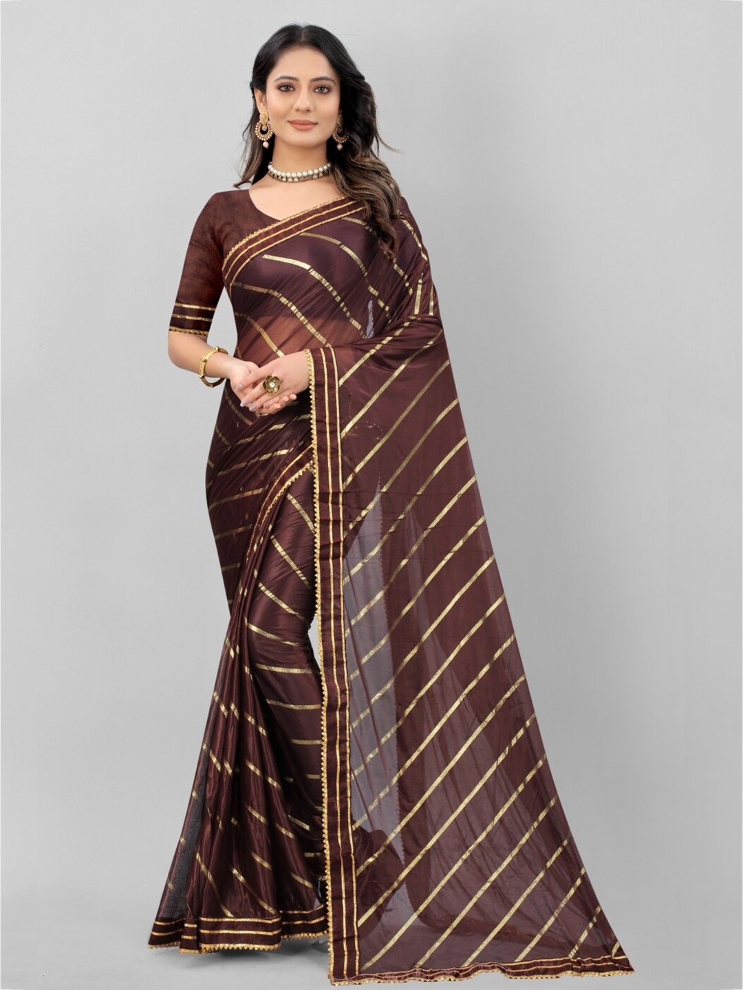 

APNISHA Brown & Gold-Toned Embellished Foil Print Patti Saree