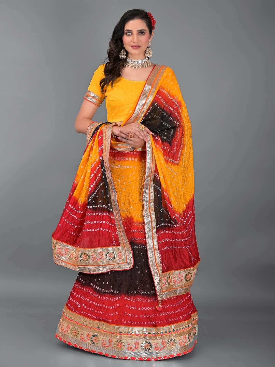 

Apratim Women Mustard & Red Semi-Stitched Lehenga & Unstitched Blouse With Dupatta