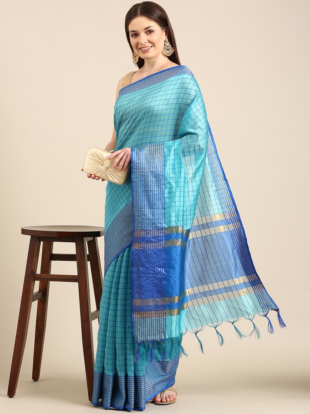 

Anouk Turquoise Blue Checked Zari Chanderi Saree