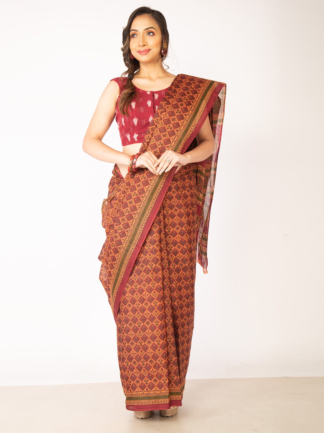 

Unnati Silks Orange & Maroon Ethnic Motifs Pure Cotton Kovai Saree