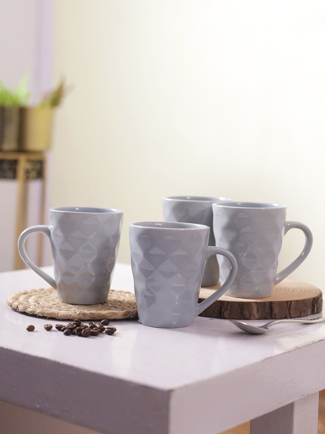 

Aapno Rajasthan Grey Set of 4 Textured Ceramic Glossy Mugs 250 ml Each