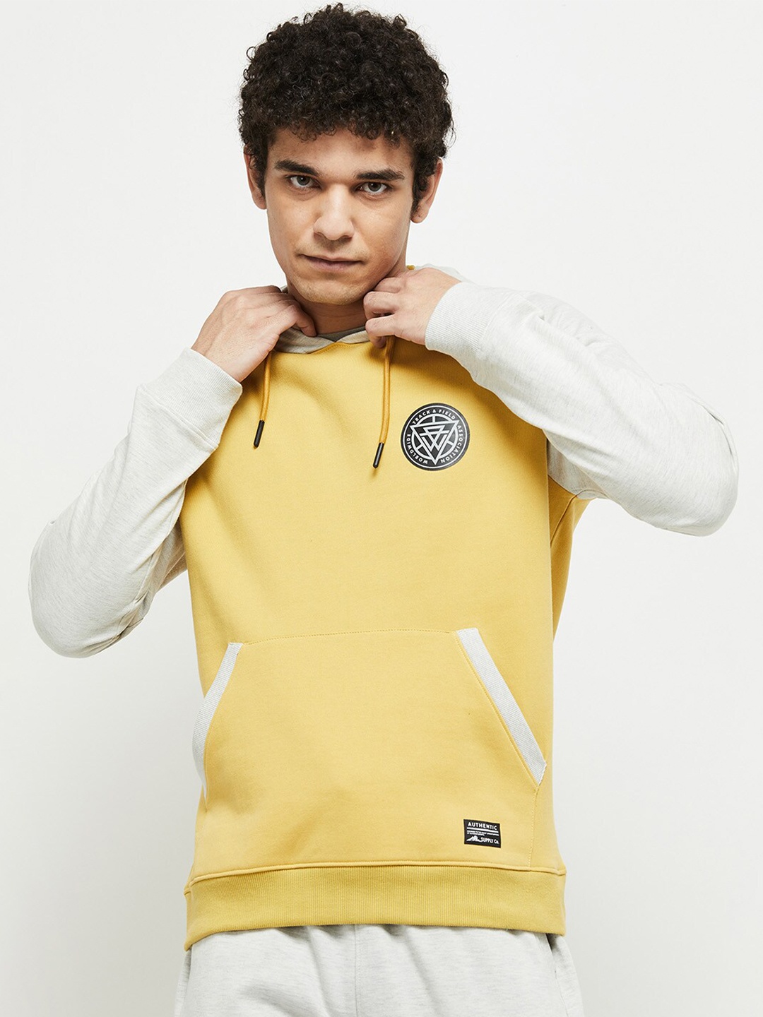 

max Men Yellow Hooded Solid Sweatshirt