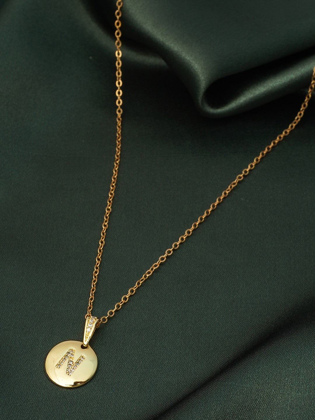 

Ferosh Women Gold-Toned Crystal-Studded Alphabet N Shaped Pendant With Shaped