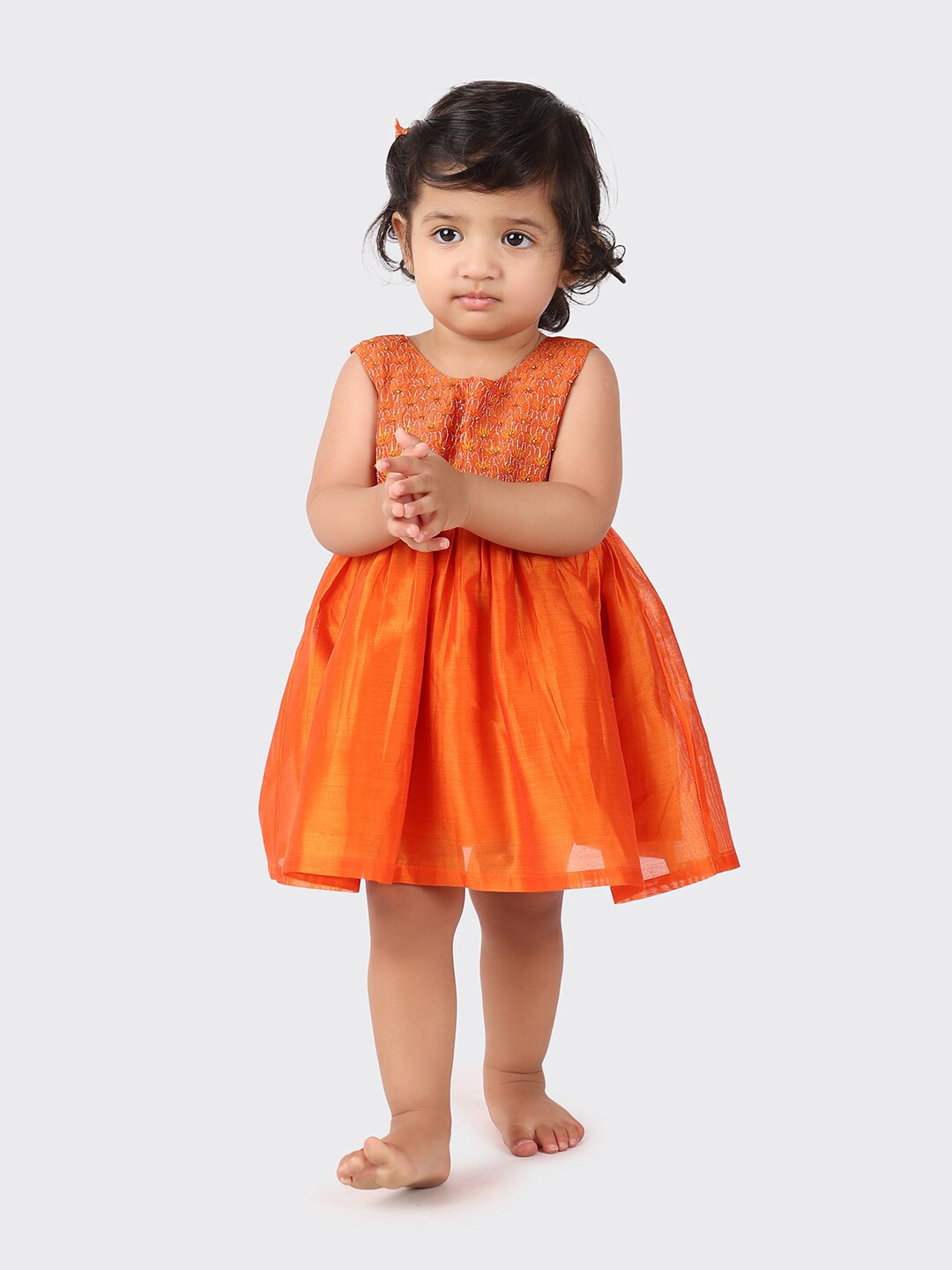 

Fabindia Girls Orange Self Design Empire Dress