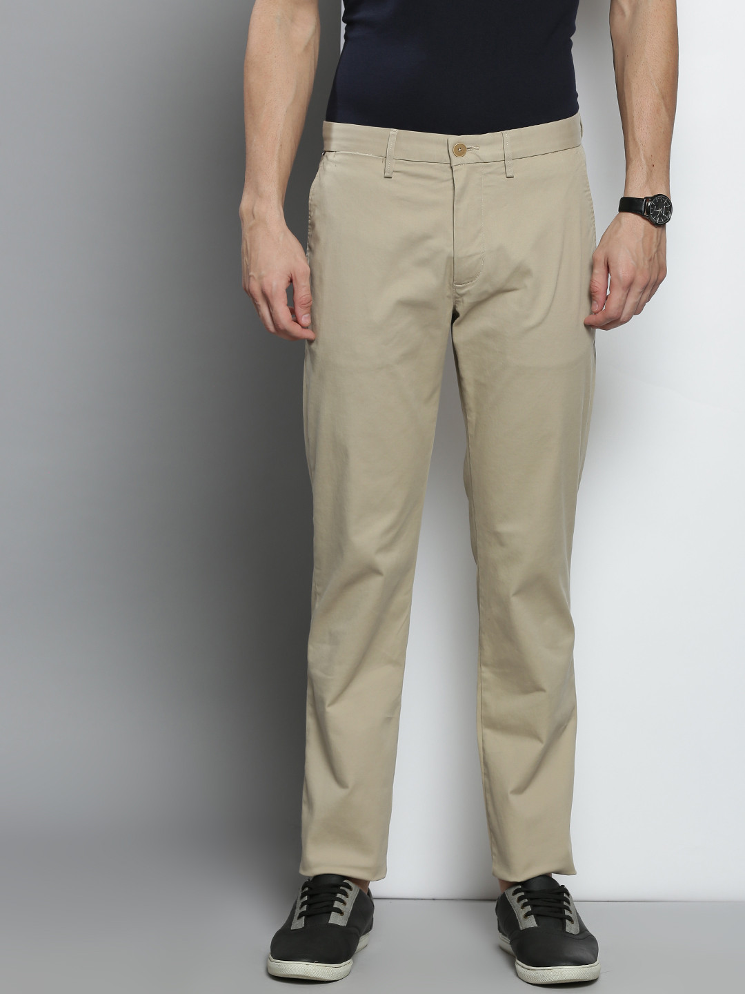 

Tommy Hilfiger Men Beige Solid Cotton Trousers