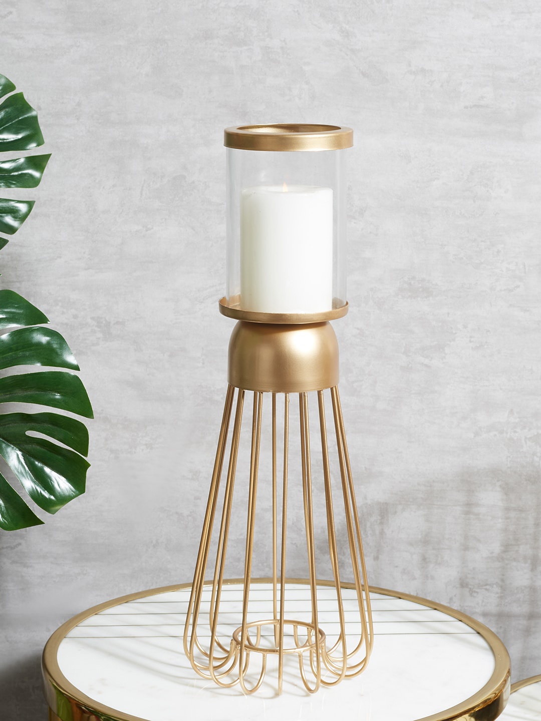 

HomeTown Gold-Toned Iron and Glass Wired Candle Stand