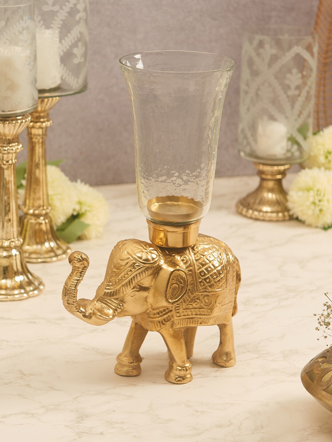 

HomeTown Gold-Toned Textured Elephant Candle Holder
