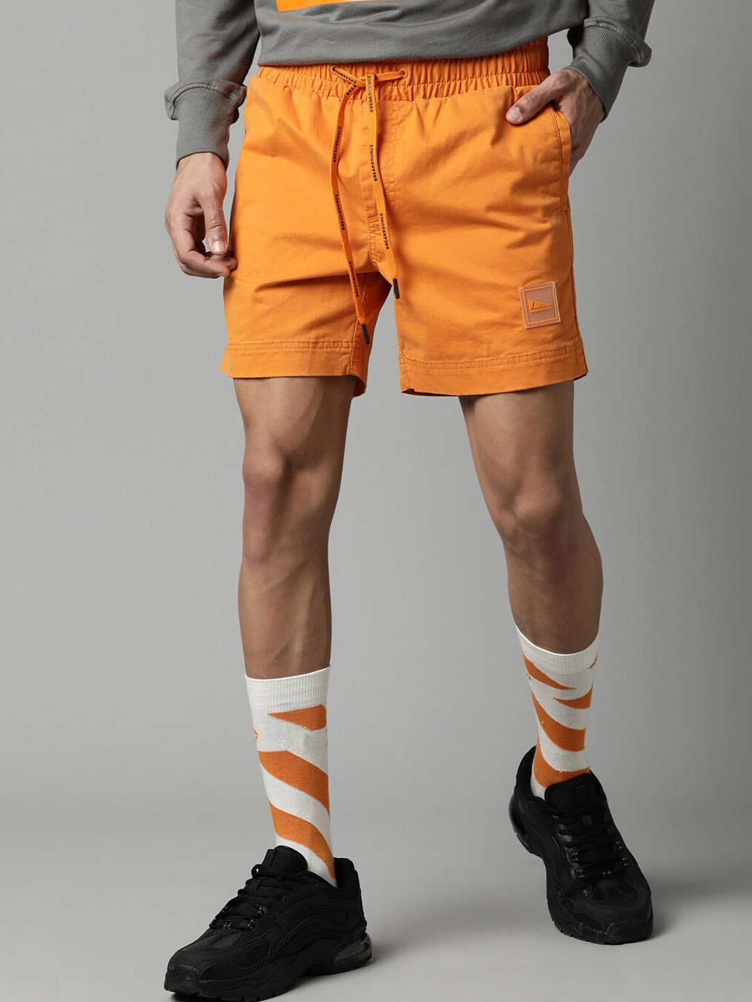 

Breakbounce Men Solid Slim Fit Cotton Shorts, Orange