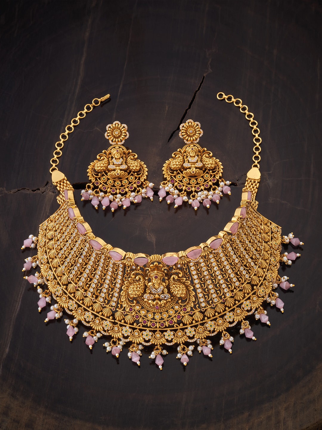 

Kushal's Fashion Jewellery Gold-Plated White & Pink Stone-Studded & Pearl Beaded Antique Jewellery Set