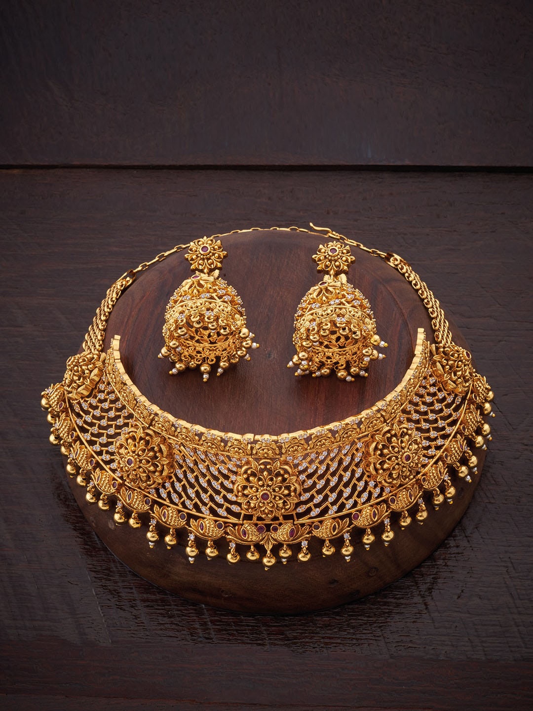 

Kushal's Fashion Jewellery Gold-Toned & White Stone Studded & Beaded Jewellery Set