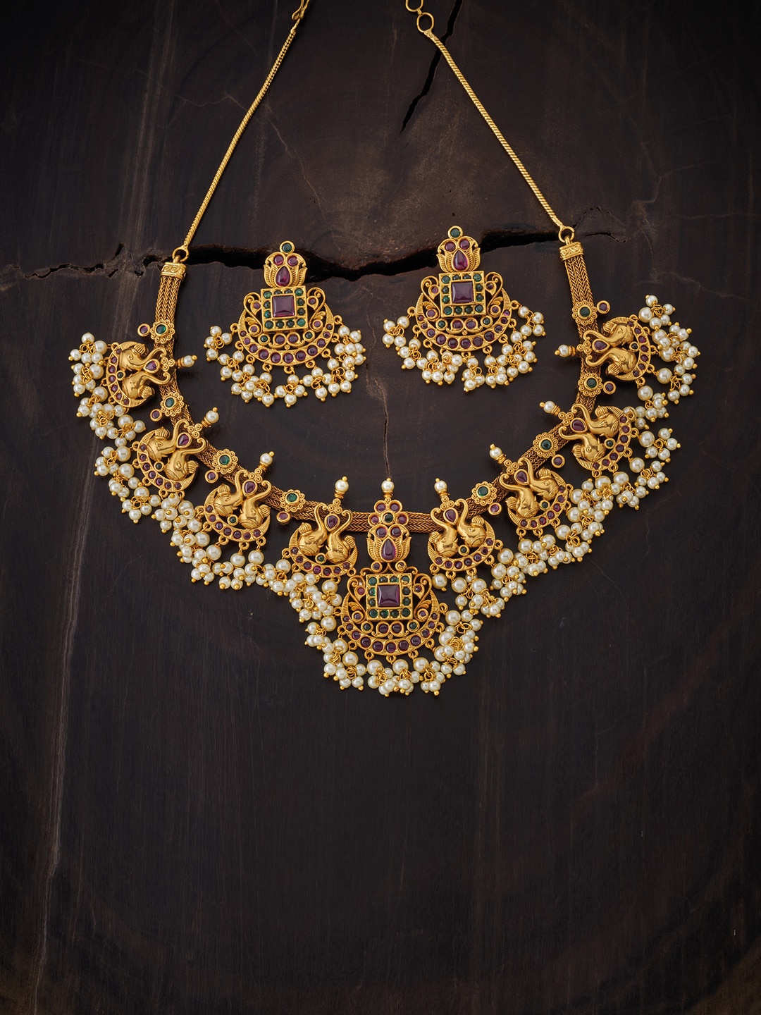 

Kushal's Fashion Jewellery Gold-Toned & Red Stone Studded & Beaded Jewellery Set