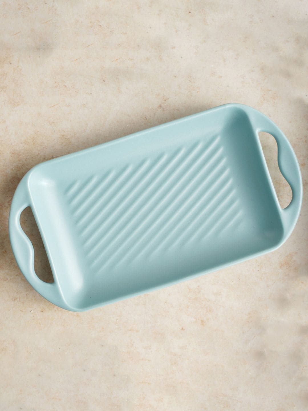 

Nestasia Blue Solid Ceramic Baking Tray With Handle