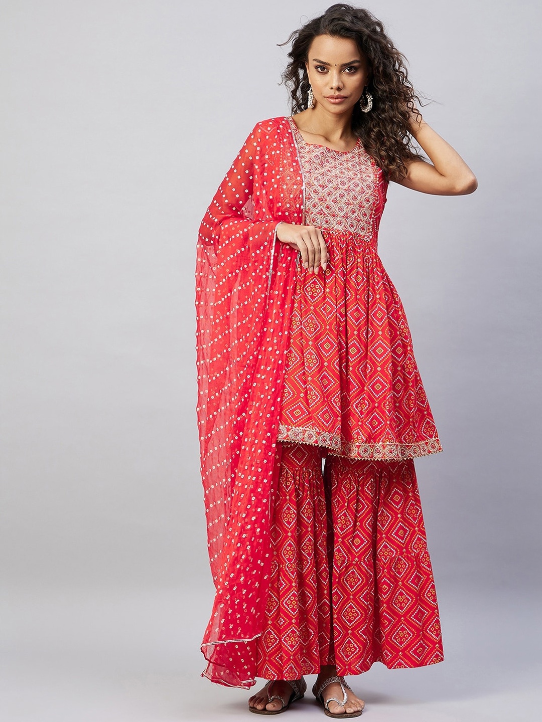 

InWeave Women Red Bandhani Printed Kurta with Sharara & With Dupatta