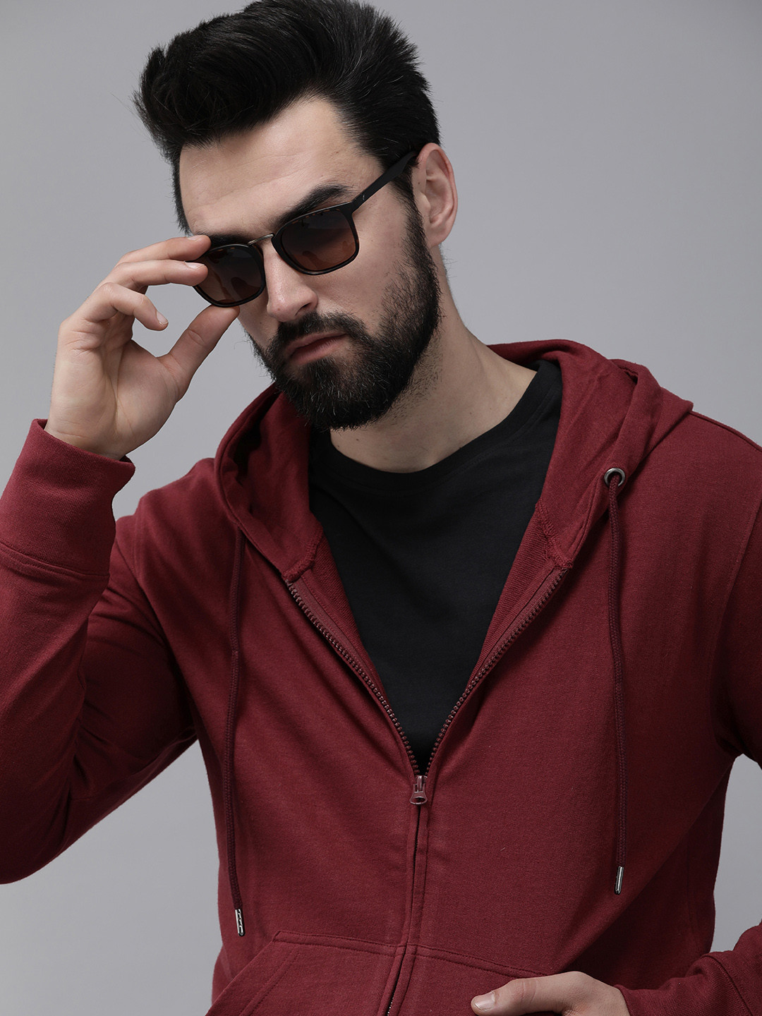 

Roadster Men Burgundy Solid Hooded Sweatshirt