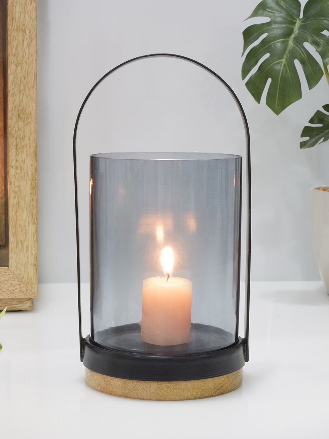 

HomeTown Black Solid Glass Lantern Candle Holder