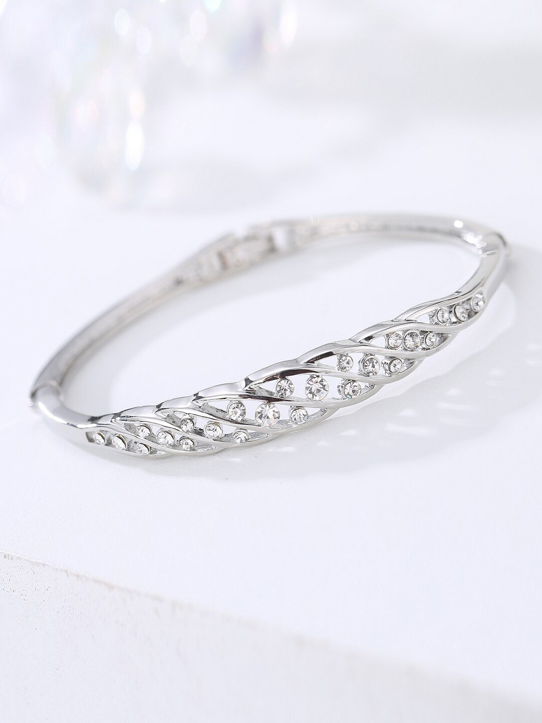 

Designs By Jewels Galaxy Women Silver-Toned Brass American Diamond Bangle-Style Bracelet