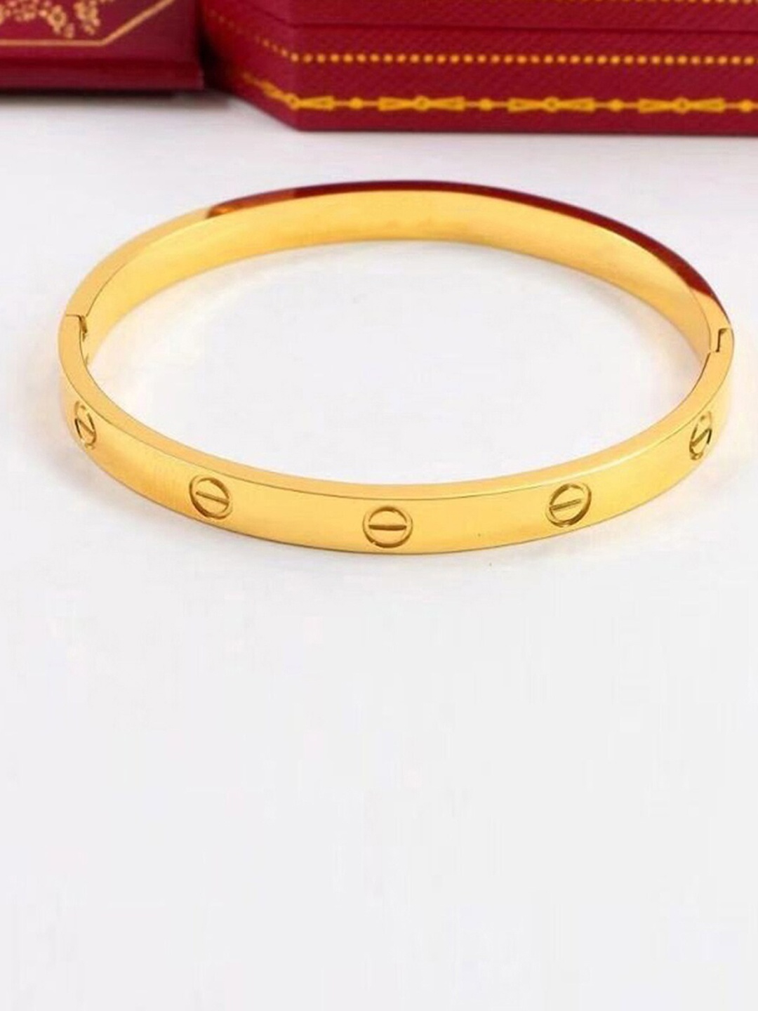 

Designs By Jewels Galaxy Women Gold-Toned Brass Gold-Plated Bangle-Style Bracelet