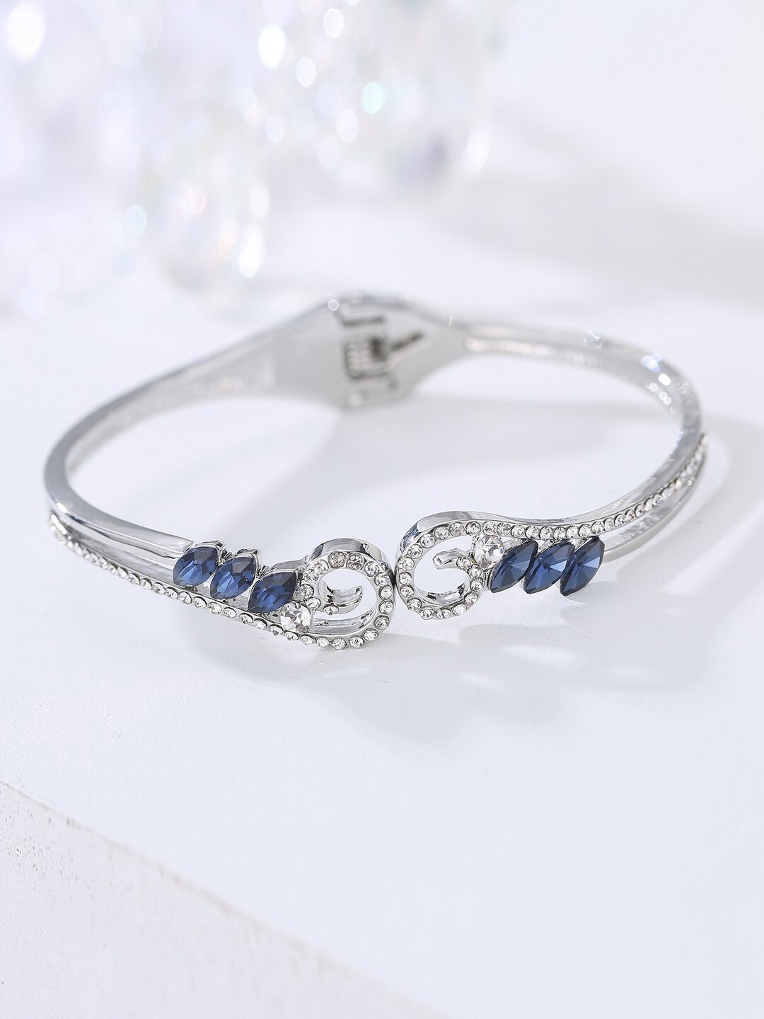 

Designs By Jewels Galaxy Women Silver-Toned & Blue American Diamond Bangle-Style Bracelet