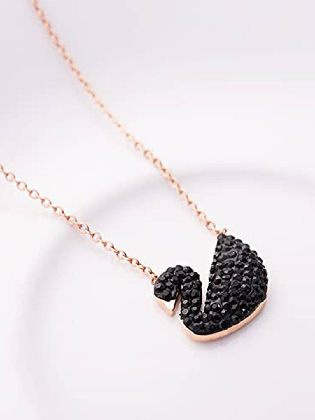 

Designs By Jewels Galaxy Women Gold-Plated Gold-Toned Black Stone Studded Swan Pendant