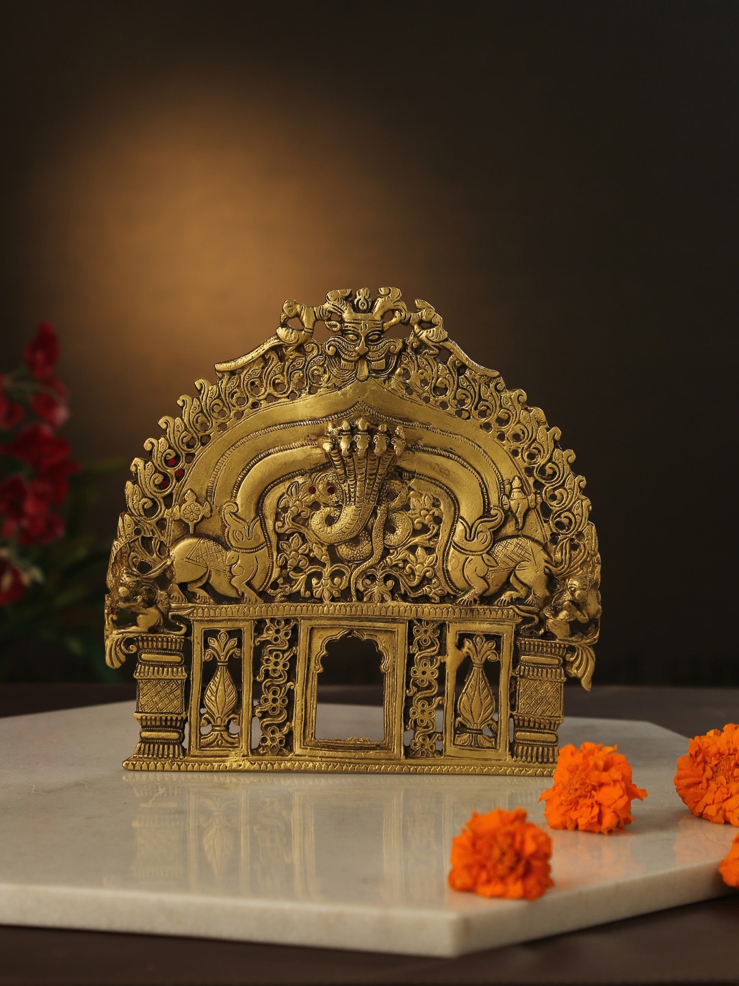 

Amoliconcepts Gold-Toned Bhujang Design Prabhavali Showpiece