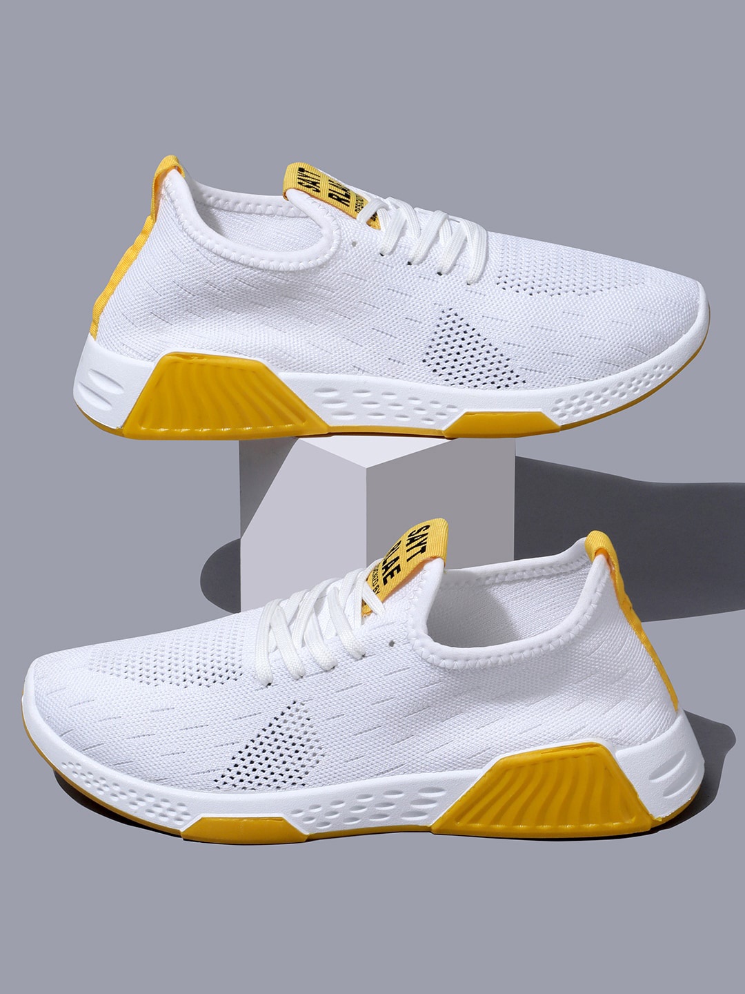 

RapidBox Men White Textured Sneakers