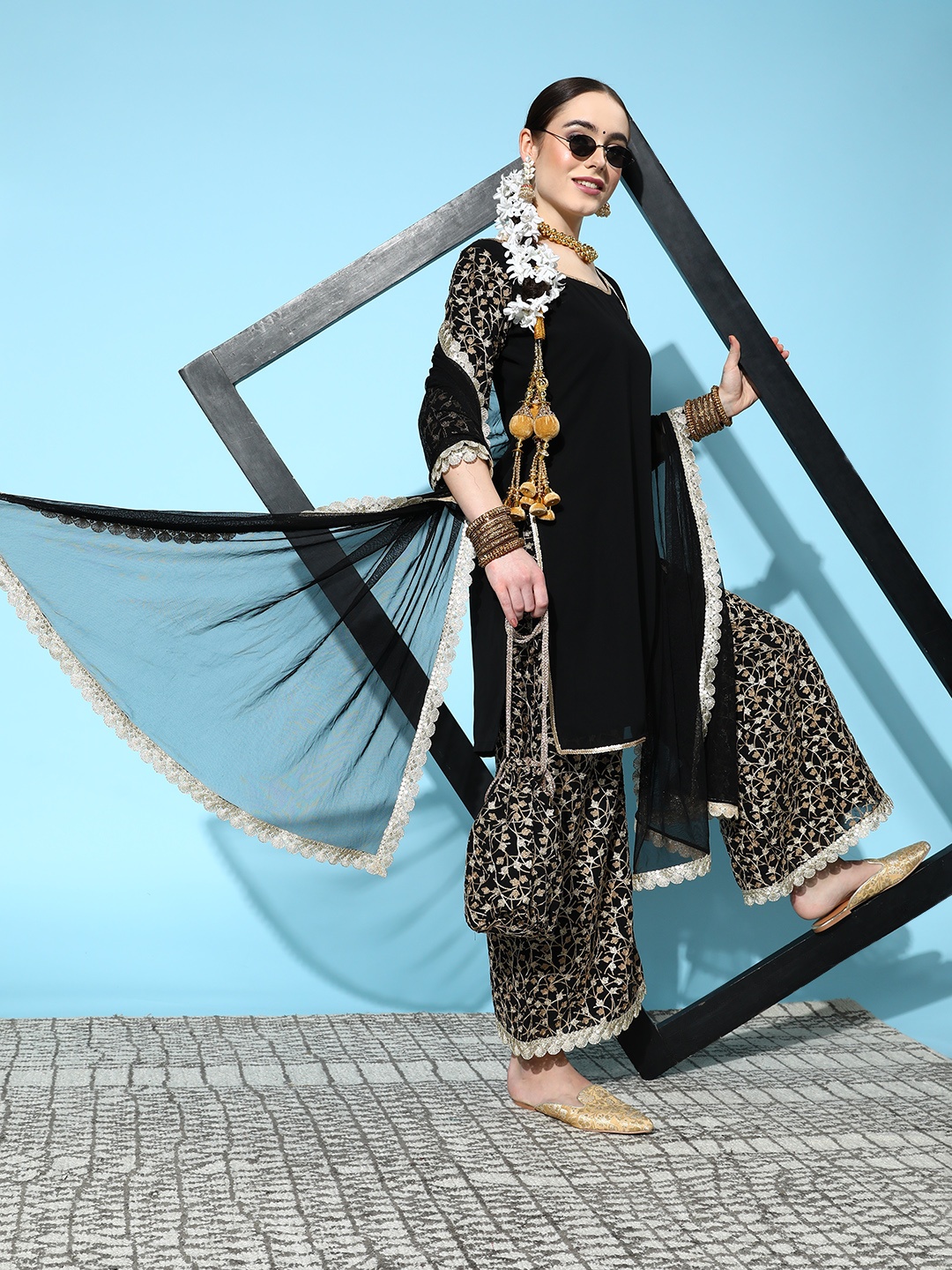 

Libas Women Black Thread Work Kurta with Palazzos & Dupatta with Potli