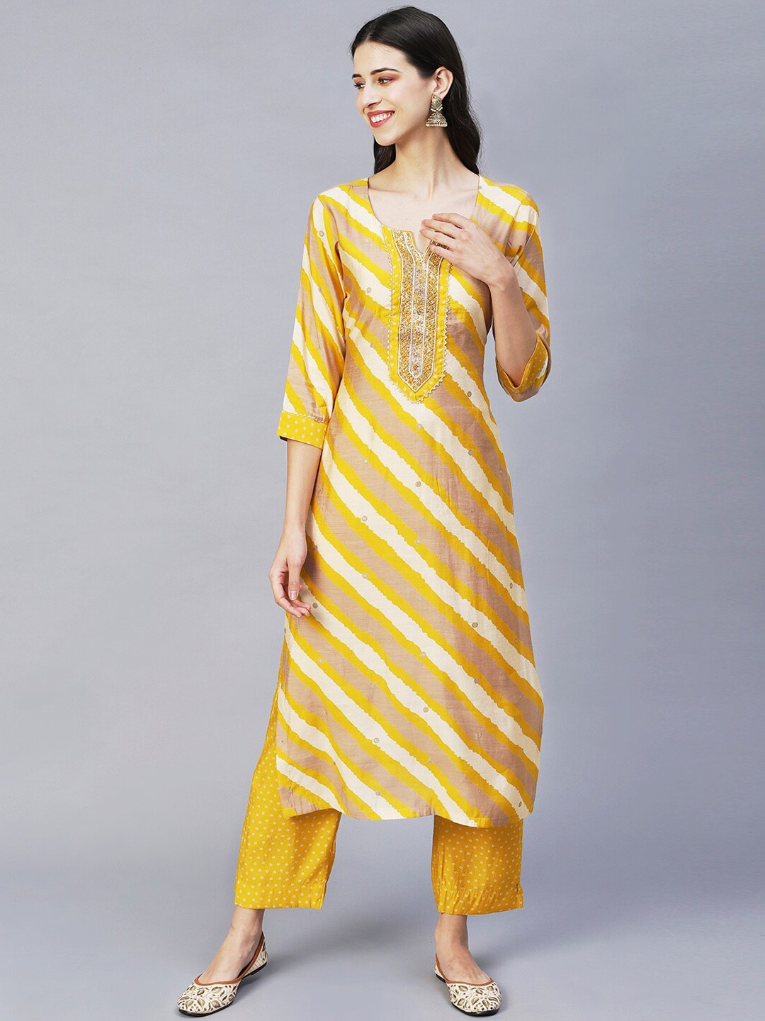 

FASHOR Women Yellow Leheriya Embroidered Beads and Stones Kurta with Trousers