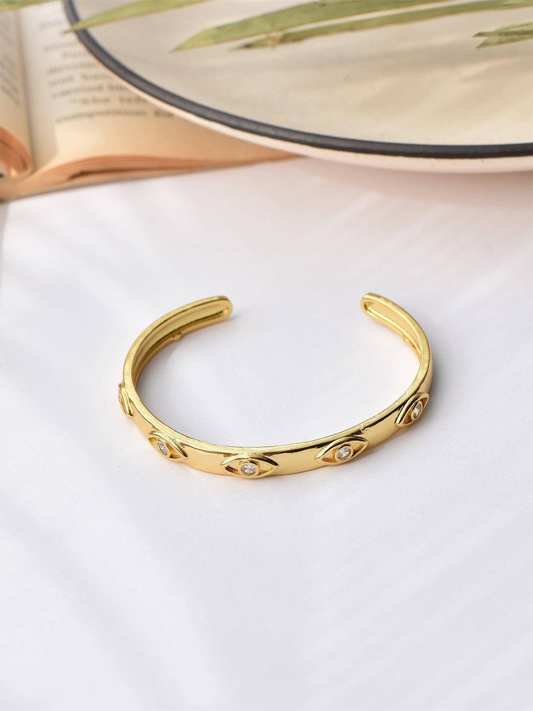 

Klissaa Women Gold-Toned & White Brass Gold-Plated Bangle-Style Bracelet