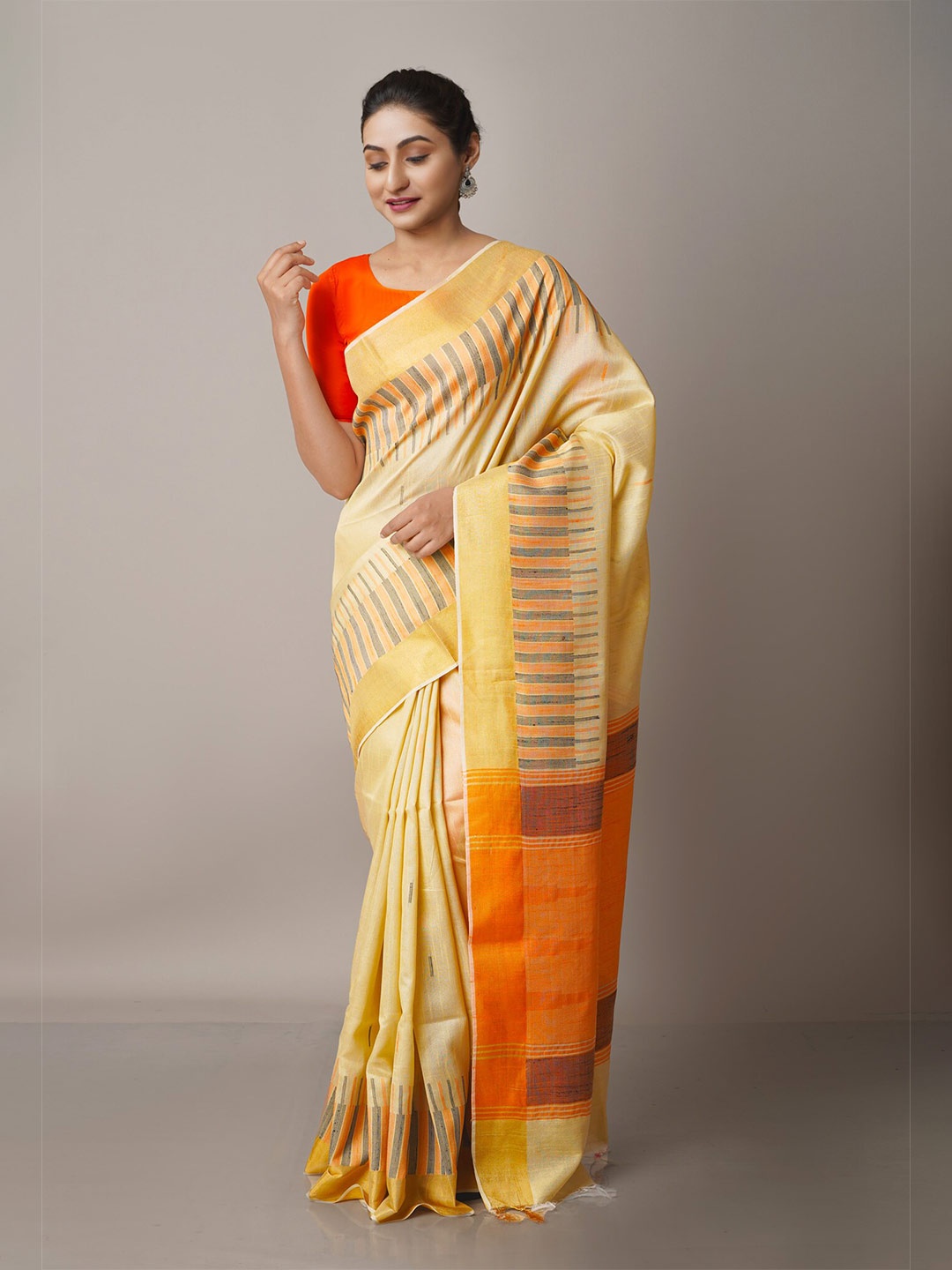 

Unnati Silks Cream-Coloured & Orange Woven Design Zari Silk Blend Jamdani Saree