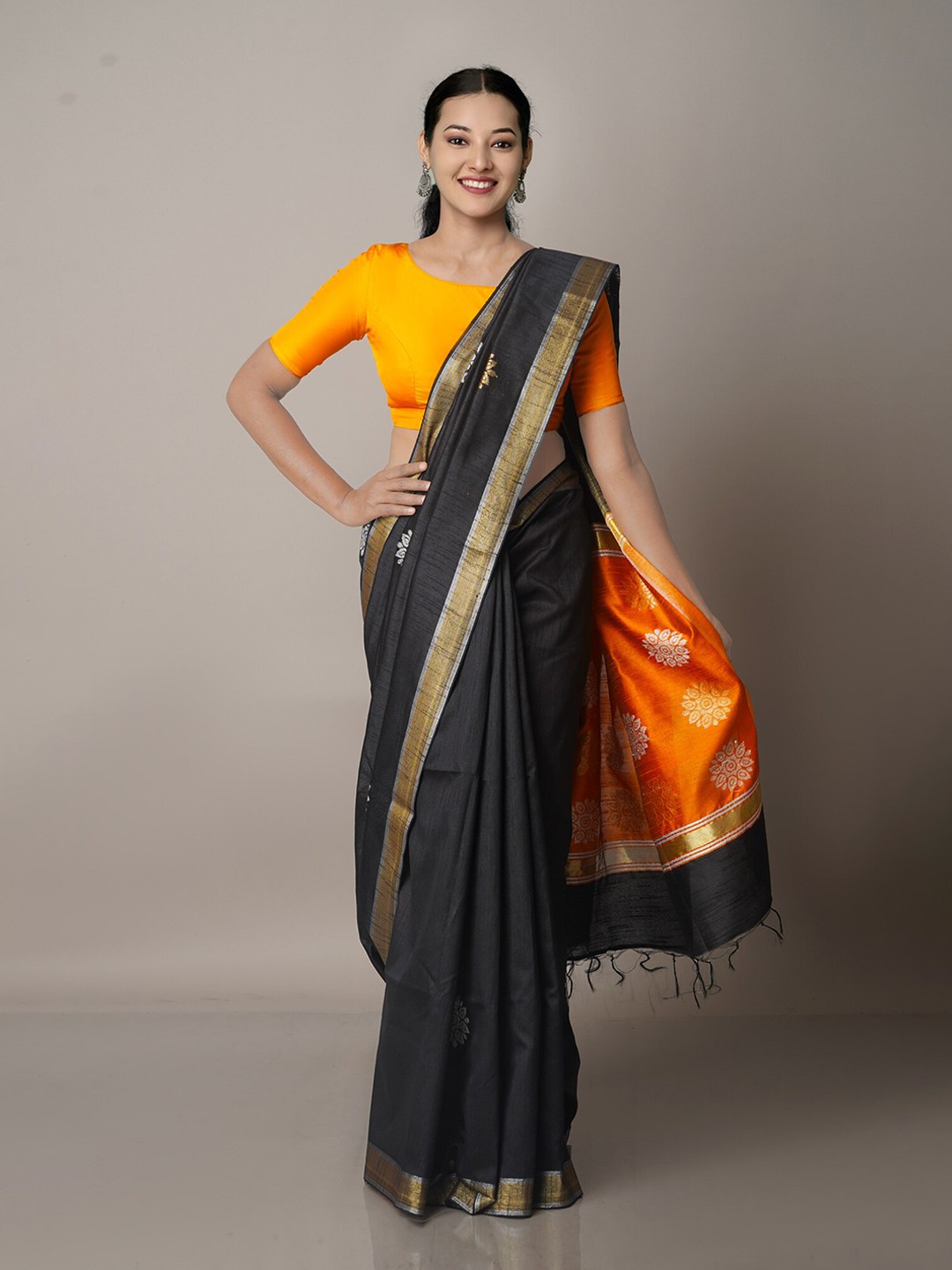 

Unnati Silks Black & Orange Woven Design Zari Silk Blend Jamdani Saree