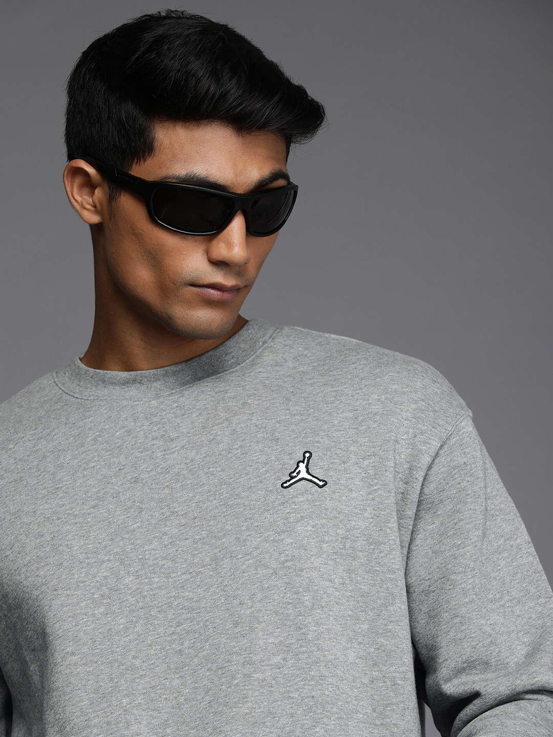 

Nike Men Grey Solid Round Neck Fleece Sweatshirt With Embroidered Detail