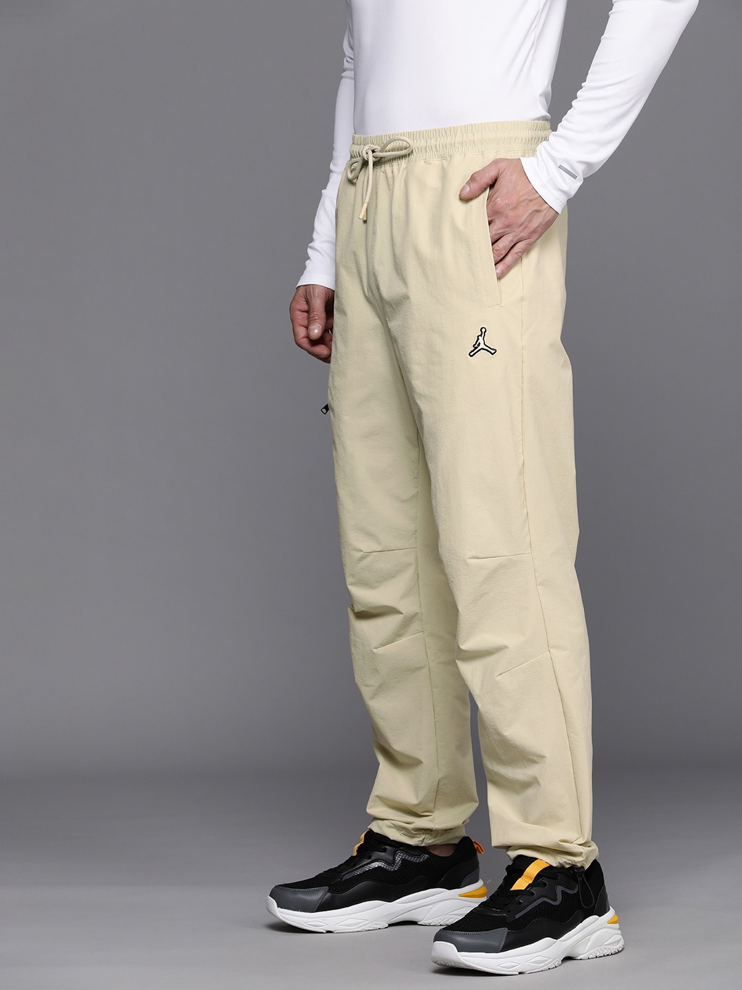 

Nike Jordan Essentials Men's Beige solid Woven Track Pants