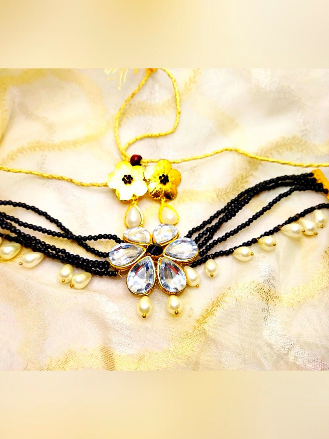 

Kshitij Jewels Gold-Plated Black Stone Studded & Beaded Jewellery Set