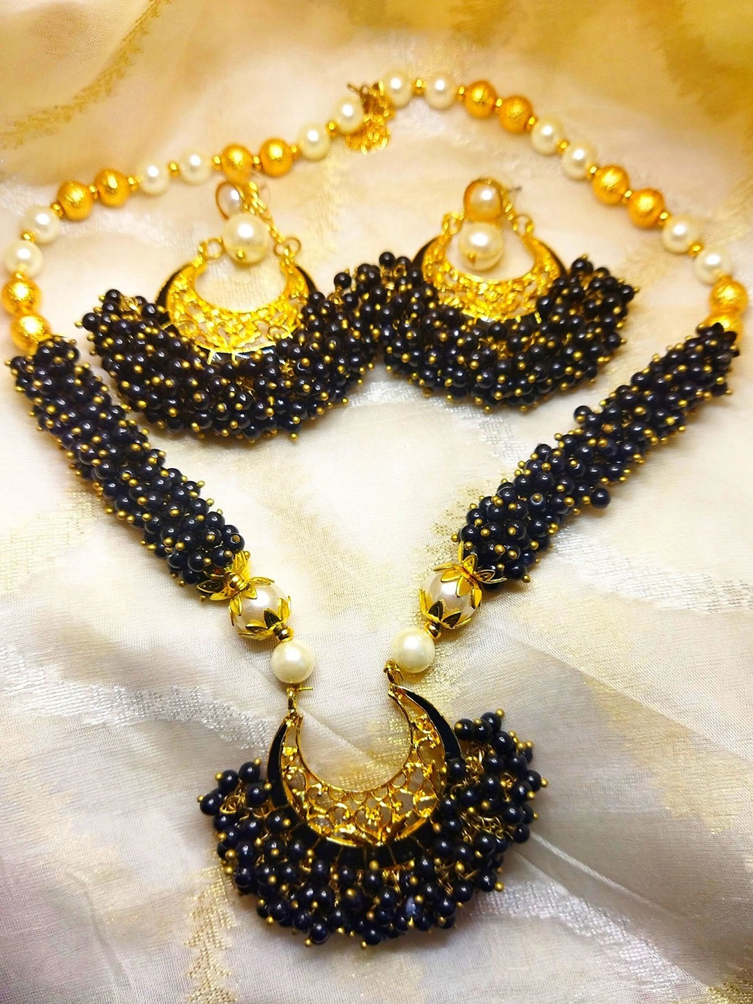 

Kshitij Jewels Gold-Plated Navy Blue Artificial Stones and Beads Jewellery Set