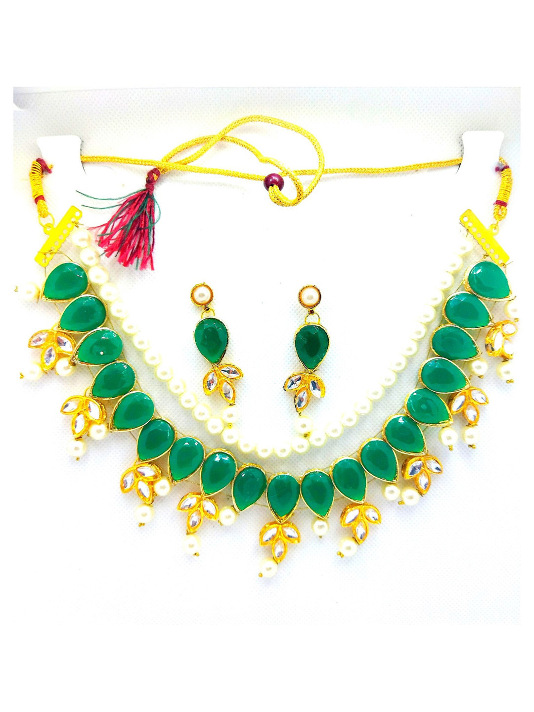

Kshitij Jewels Gold-Plated Green Artificial Stone Studded Jewellery Set